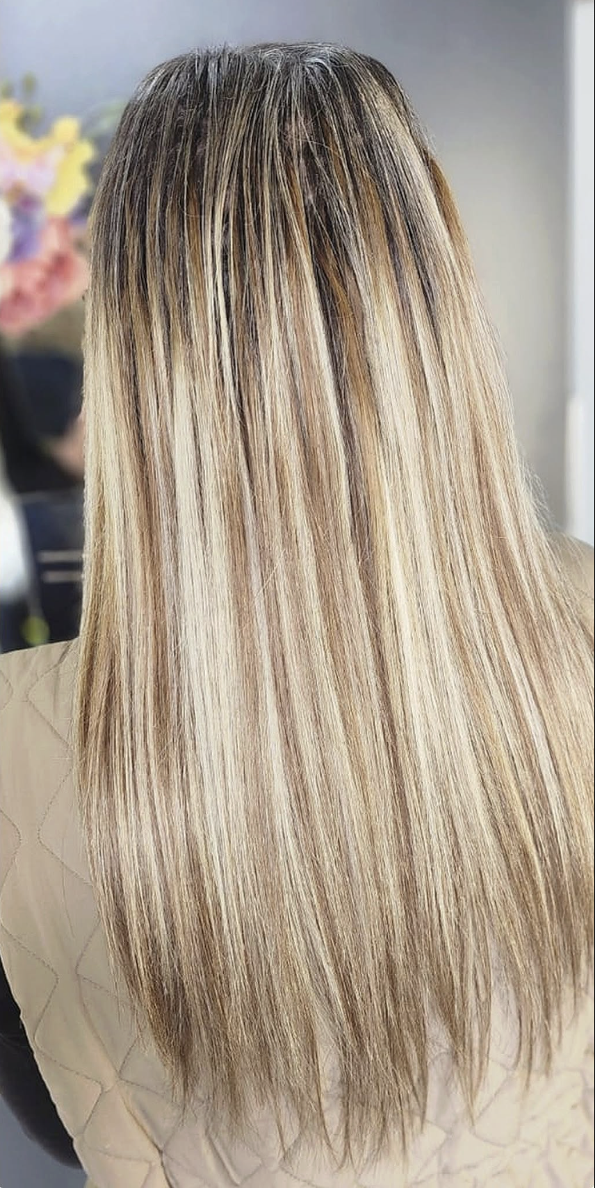 Long seamless blonde-highlighted hair extensions result at Belle Vee